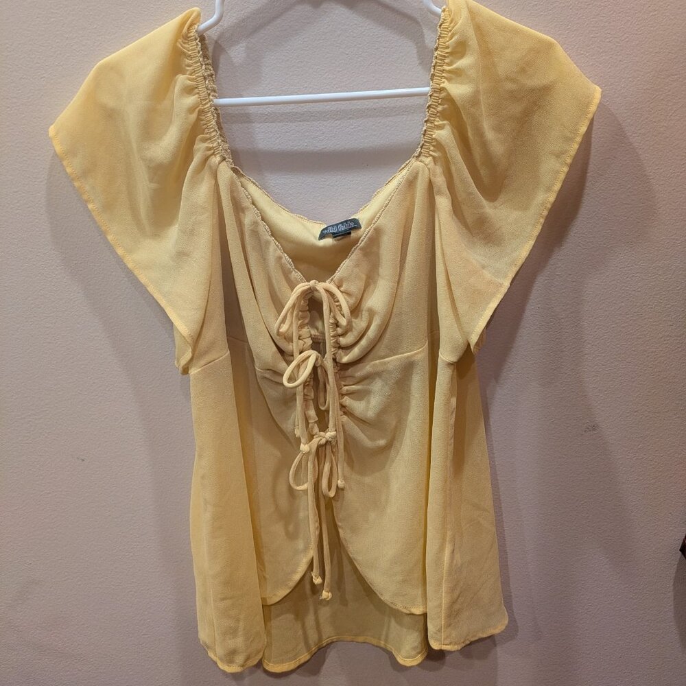 Flowy yellow sheer top with bows
